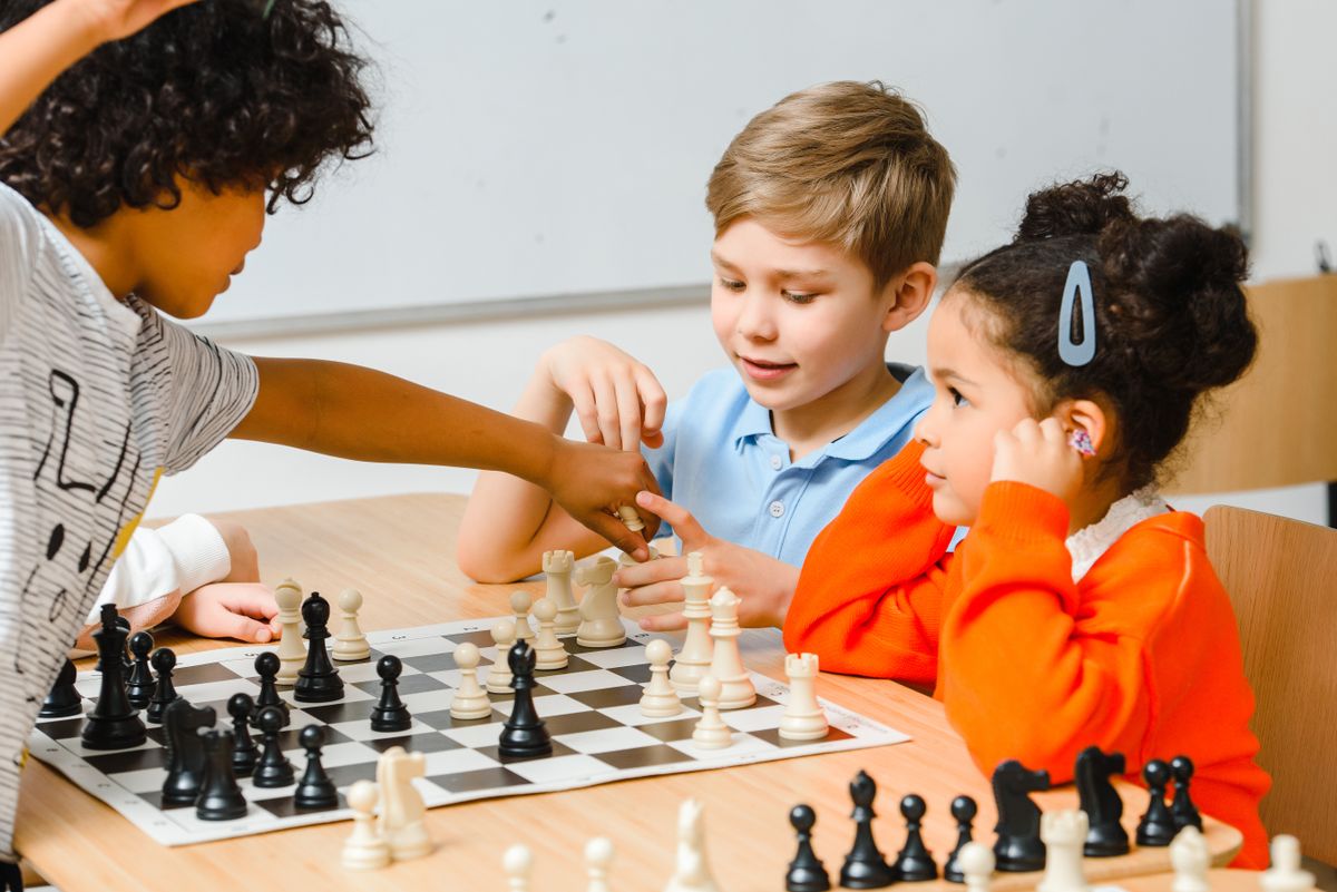 Children playing chess at an after-school chess club